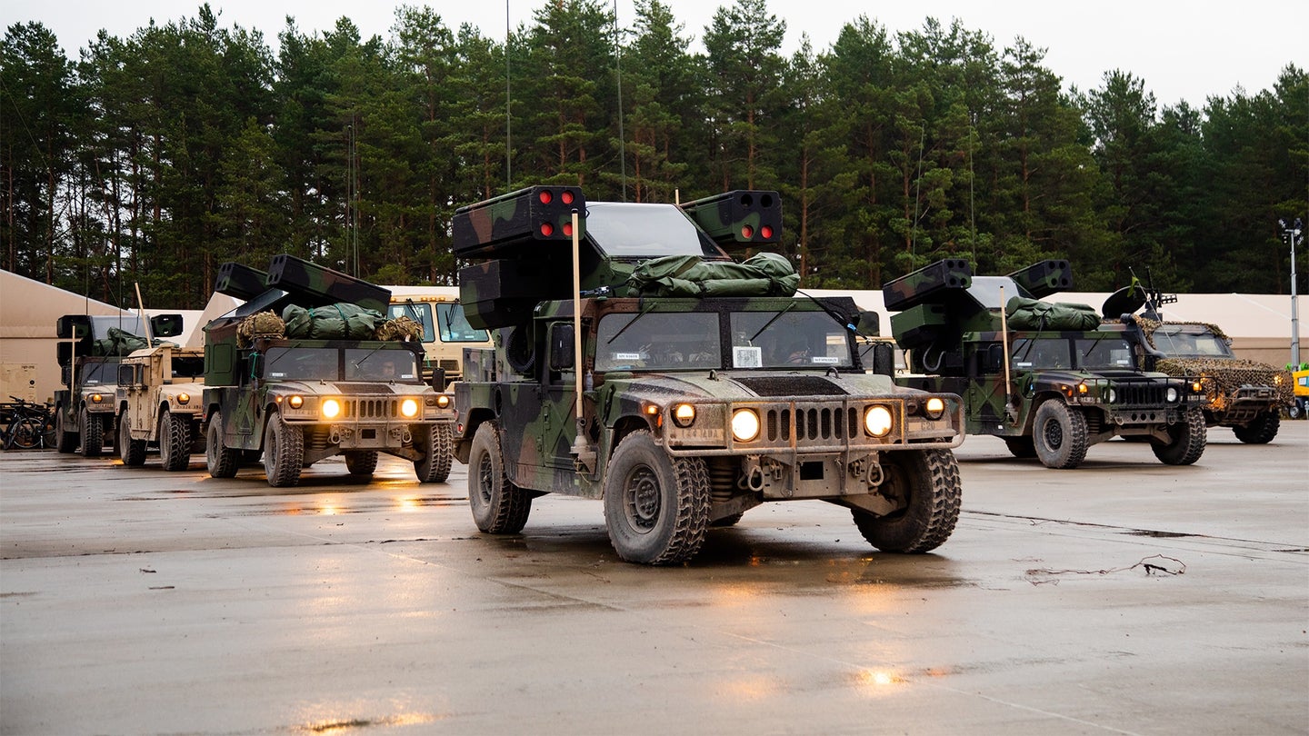 U.S. Soldiers assigned to Bravo Battery, Death Dealers, 2nd Battalion, 174th Air Defense Artillery Regiment (2-174 ADA) operationally controlled by 1st Infantry Division (1 ID), prepare AN/TWQ-1 Avenger self-propelled Surface-to-Air missile systems for a convoy during a field training exercise, Operation Close Encounters at Camp Ādaži, Latvia, Nov. 9, 2022. (U.S. Army National Guard photo by Spc. Casandra B. Ancheta)
