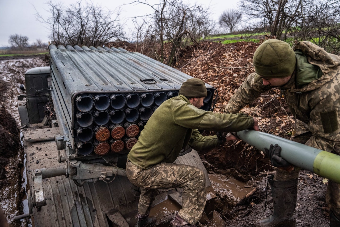 DONETSK OBLAST, UKRAINE - 2022/11/20: Soldiers from the 10th Mountain Assault Brigade of Ukraine unload munitions from a BM-21 Grad multiple rocket launcher near the frontlines in Donbas, Ukraine. (Photo by Laurel Chor/SOPA Images/LightRocket via Getty Images)