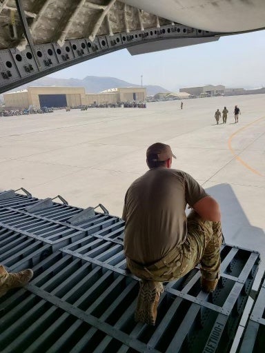 Air Force Tech Sgt. Ethan Schaffner awaits passengers about to board a C-17 transport jet on the flightline in Kabul, Afghanistan during Operation Allies Refuge, August, 2021. (Courtesy photo)