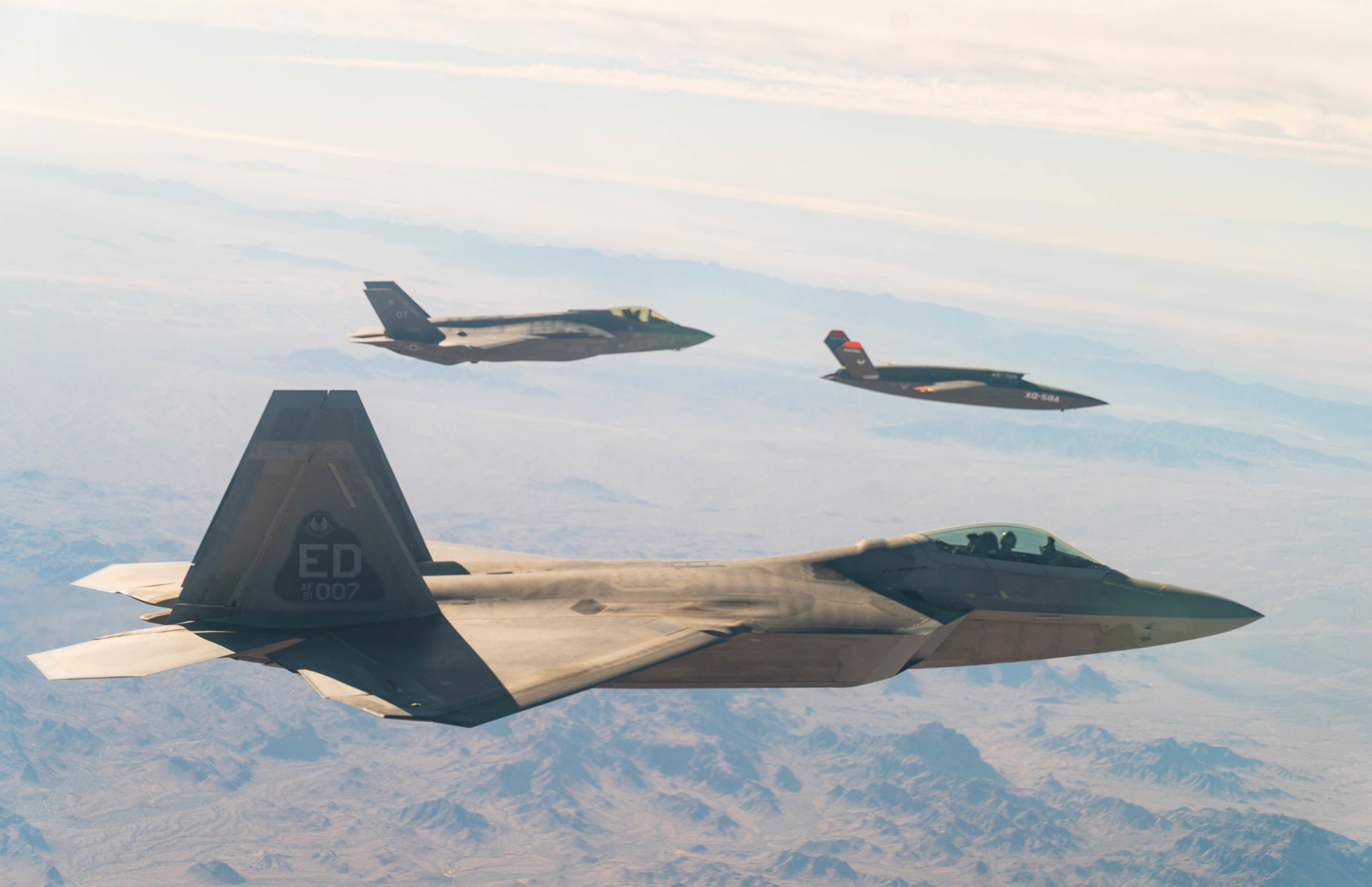 F-22 Raptor networked with an F-35 Joint Strike Fighter via XQ-58 Valkyrie
