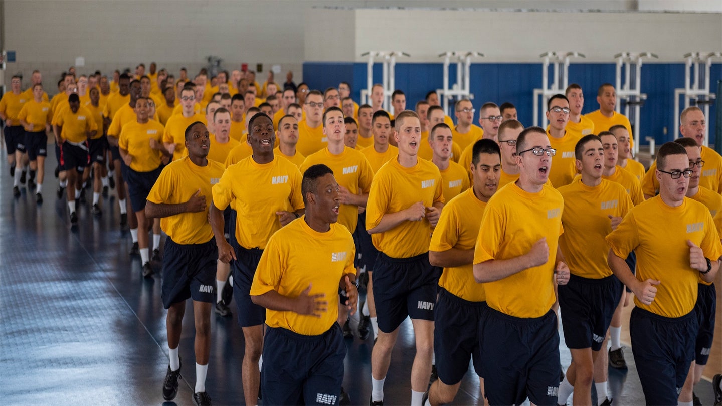 Recruits perform a warm-up run during a physical training session inside Freedom Hall at Recruit Training Command in Aug. 2019. (U.S. Navy photo by Mass Communication Specialist 2nd Class Camilo Fernan)