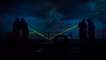 Navy sailors used laser rifles to ward off an Iranian boat in the Strait of Hormuz