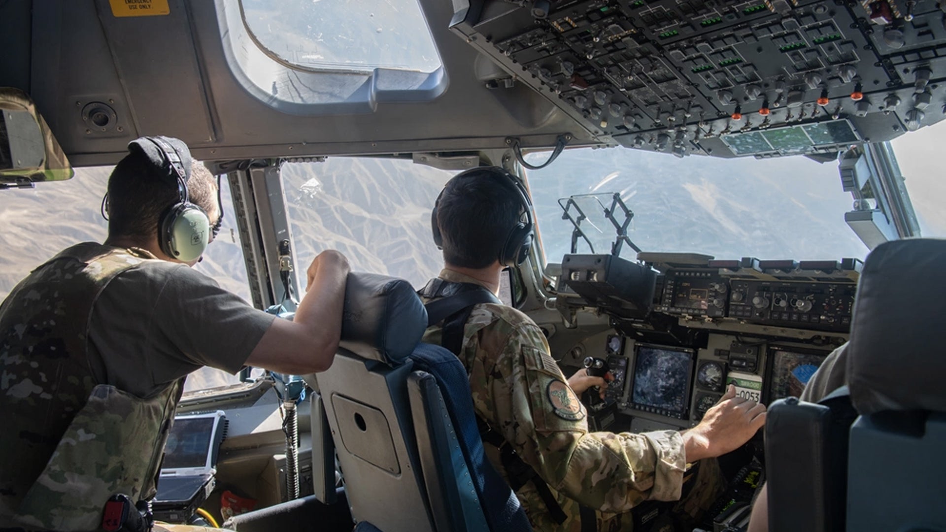 U.S. Air Force C-17 Globemaster III pilots, assigned to the 816th Expeditionary Airlift Squadron, flies a mission in support of the Afghanistan evacuation over the U.S. Central Command area of responsibility, Aug. 24, 2021. (Master Sgt. Donald R. Allen/U.S. Air Force)