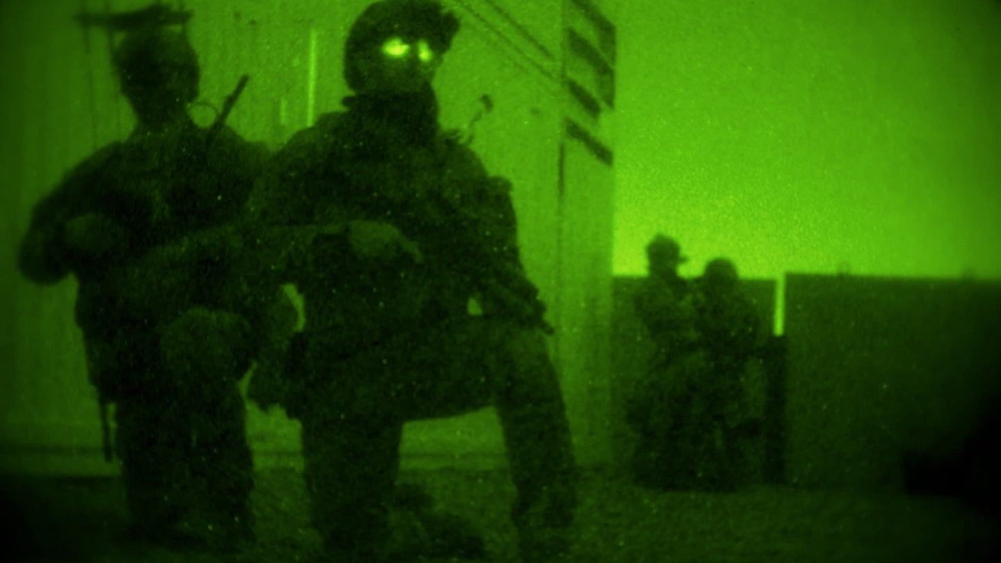 Marine Raiders with Marine Special Operations Company Charlie, 1st Marine Raider Battalion, set up a cordon around the perimeter of a building while conducting a notional direct-action night raid, Oct. 17, 2015, in Florence, Ariz. (Marine Corps photo)