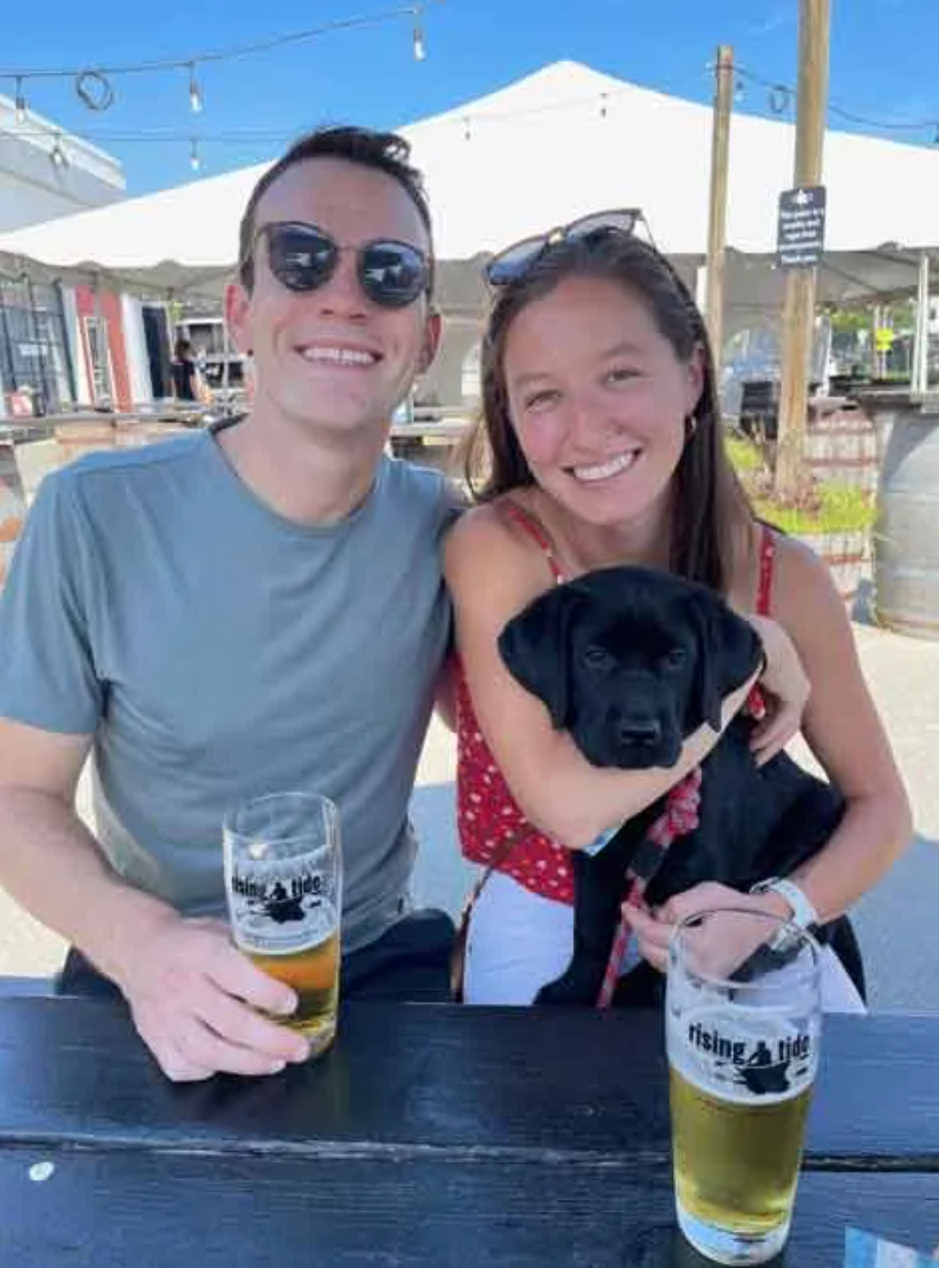 Cameron McMillan, pictured with his fiancé and their puppy, served as a field artillery officer in the Army National Guard for four years. (Courtesy of Cameron McMillan)