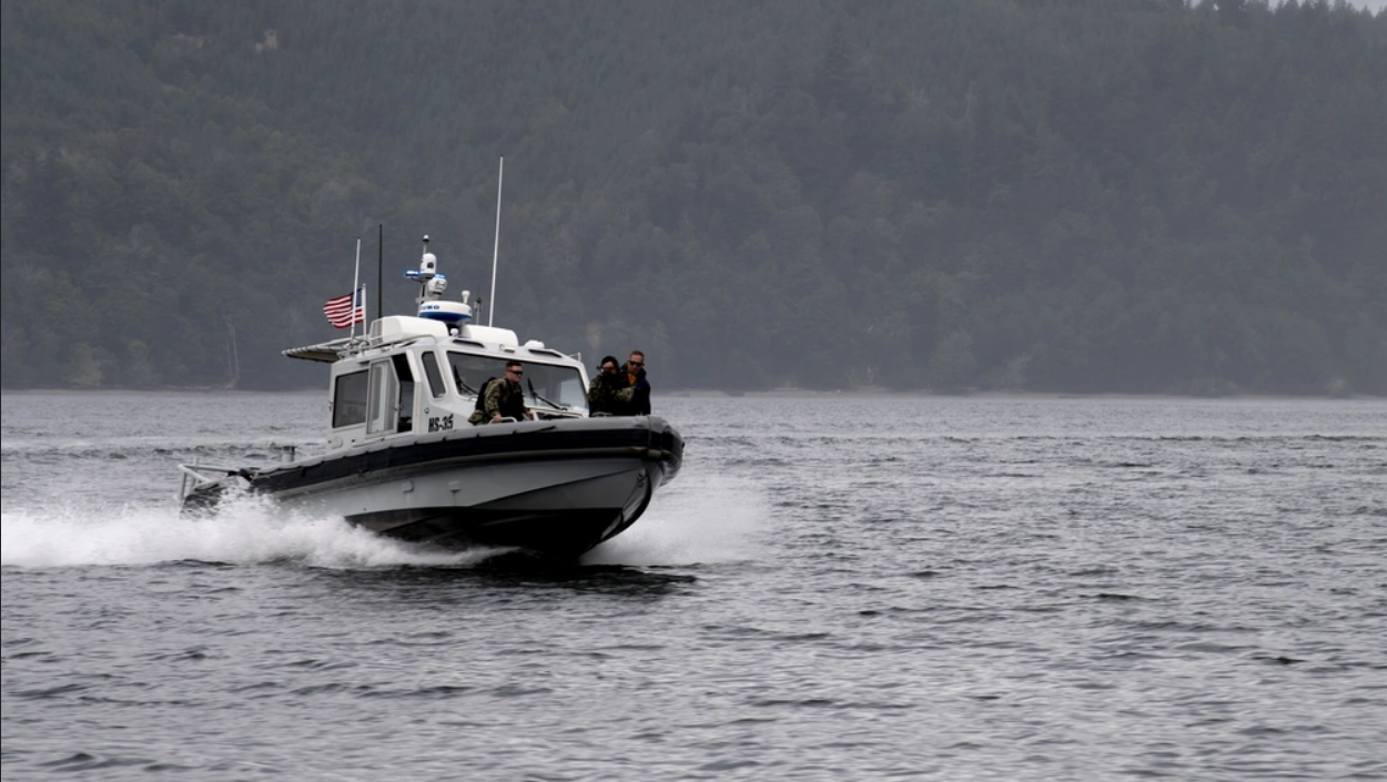 A naval patrol boat moves through Naval Base Kitsap-Bangor's harbor. (Photo by Mass Communication Specialist 2nd Class Allen Lee/U.S. Navy)