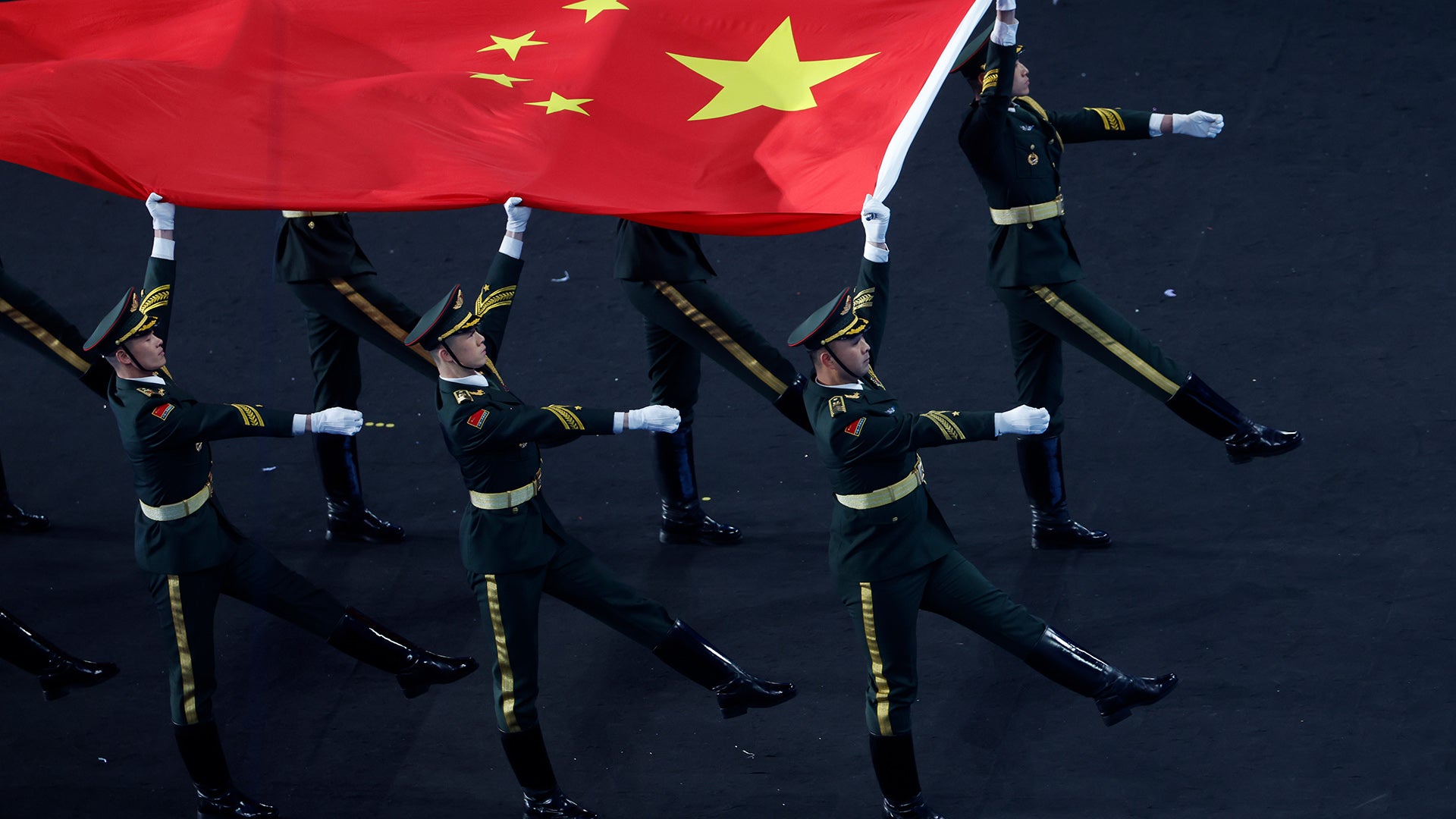 BEIJING, CHINA - FEBRUARY 4: Soldiers carry Chinese flag during the opening ceremony of 2022 Beijing Winter Olympics in Beijing, China, 04 February 2022. The Olympic Games in Beijing will continue until Feb. 20, when the medal games and closing ceremony will take place. (Photo by Aleksey Kirchu/Anadolu Agency via Getty Images)