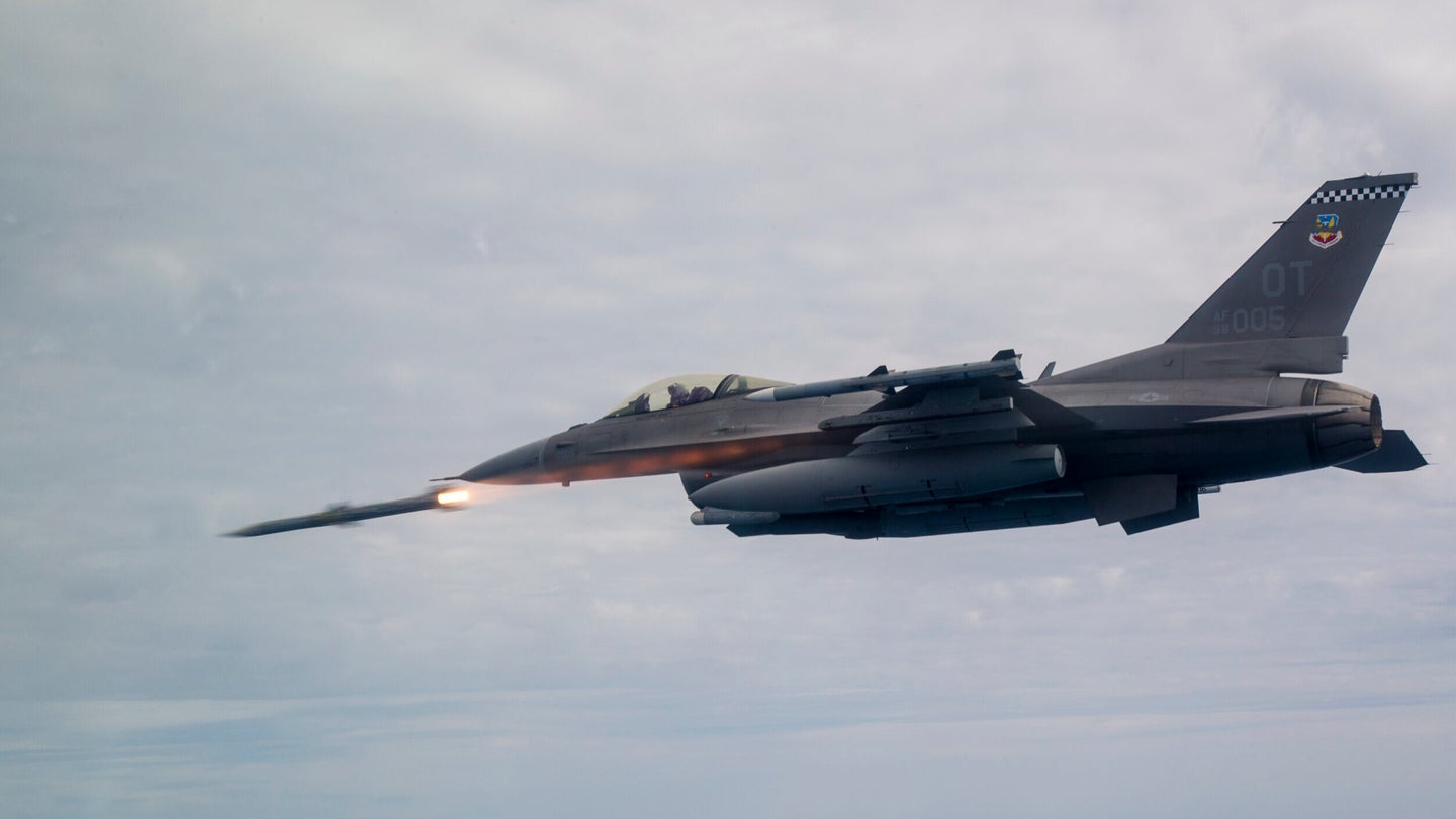 An F-16C Fighting Falcon assigned to the 85th Test Evaluation Squadron shoots an AIM-120 Advanced Medium-Range Air-to-Air Missile, or AMRAAM over testing ranges near Eglin Air Force Base, Fla., March 19, 2019. The AMRAAM is a modern beyond-visual-range air-to-air missile capable of all-weather day-and-night operations. (Senior Airman Joshua Hoskins/U.S. Air Force)