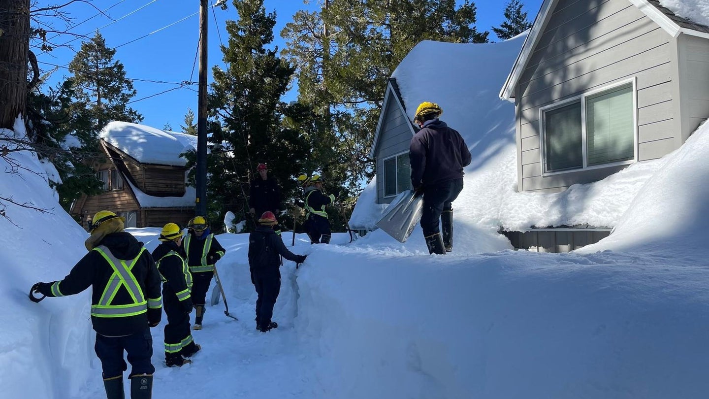 Members of the California National Guard's Joint Task Force Rattlesnake go door to door to help people trapped in the San Bernardino Mountains. (photo courtesy California National Guard)