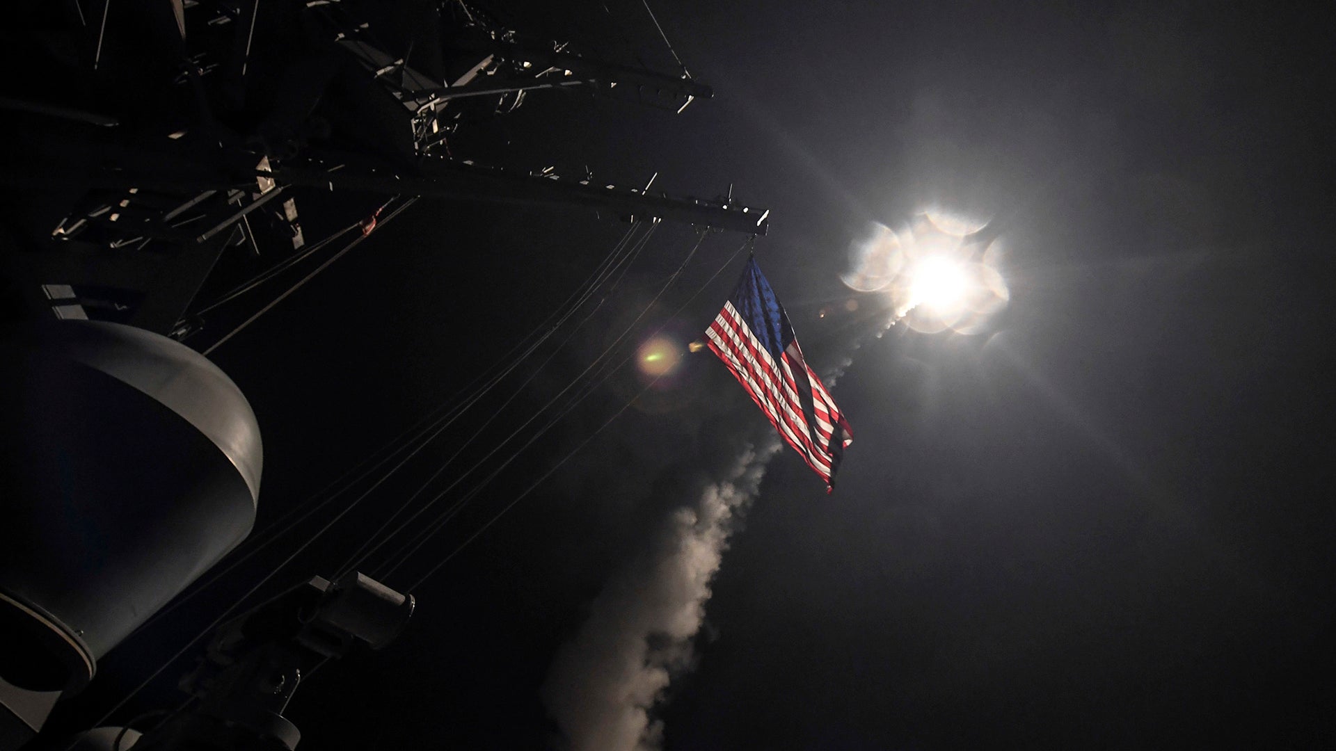 In this image provided by the U.S. Navy, the guided-missile destroyer USS Porter (DDG 78) launches a tomahawk land attack missile in the Mediterranean Sea, Friday, April 7, 2017. The United States blasted a Syrian air base with a barrage of cruise missiles in fiery retaliation for this week's gruesome chemical weapons attack against civilians.  (Mass Communication Specialist 3rd Class Ford Williams/U.S. Navy via AP)