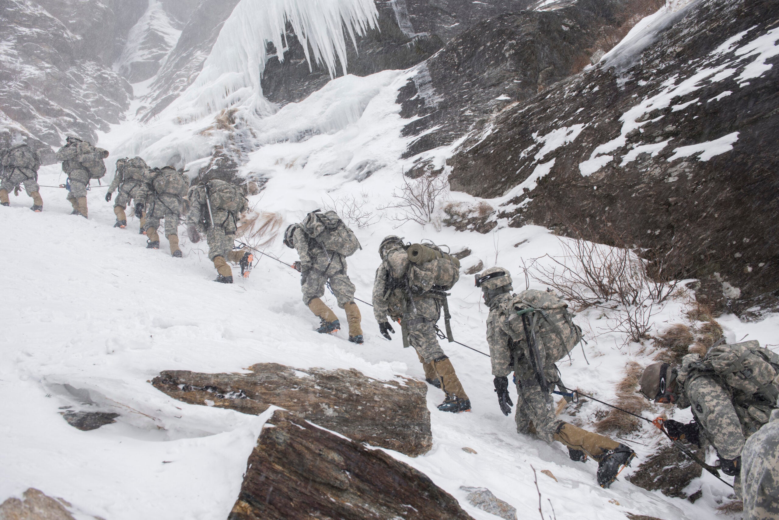 Soldiers attending the U.S. Army Mountain Warfare School in Jericho, Vt., climb Smugglers' Notch as part of their final phase of the Basic Military Mountaineering Course, in Jeffersonville, Vt., Feb. 19, 2015. Students in the Basic Military Mountaineering course spend two weeks acquiring the skills and knowledge required to operate in mountainous terrain. (U.S. Air National Guard photo by Tech. Sgt. Sarah Mattison)