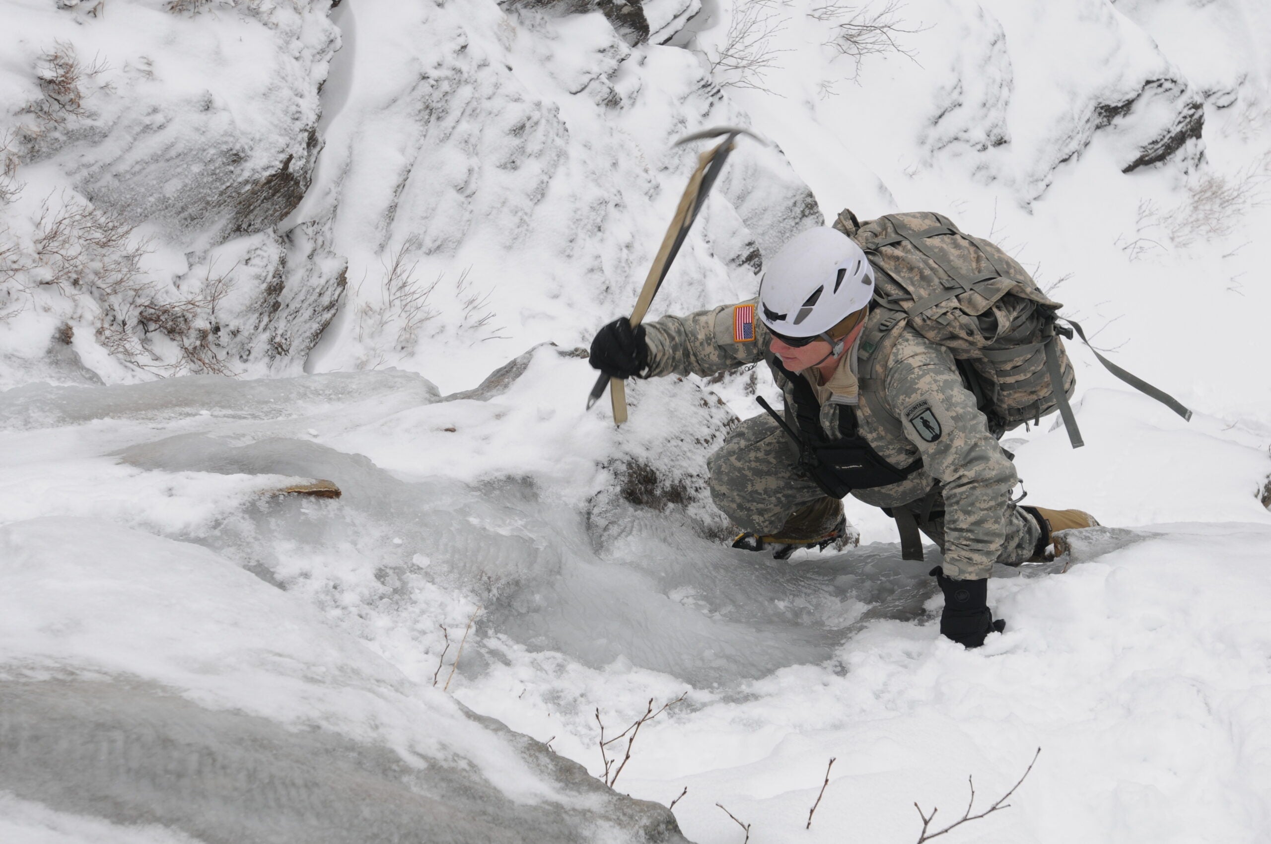 An instructor with the U.S. Army's Mountain Warfare School leads Soldiers on an ascent through a ravine at Smugglers' Notch, Vt., Feb. 14, 2013. The two-week course is taught by the Vermont National Guard at Ethan Allen Firing Range in Jericho, Vt.  (U.S. Army photo by 1st Lt. Jeffrey Rivard/Released)