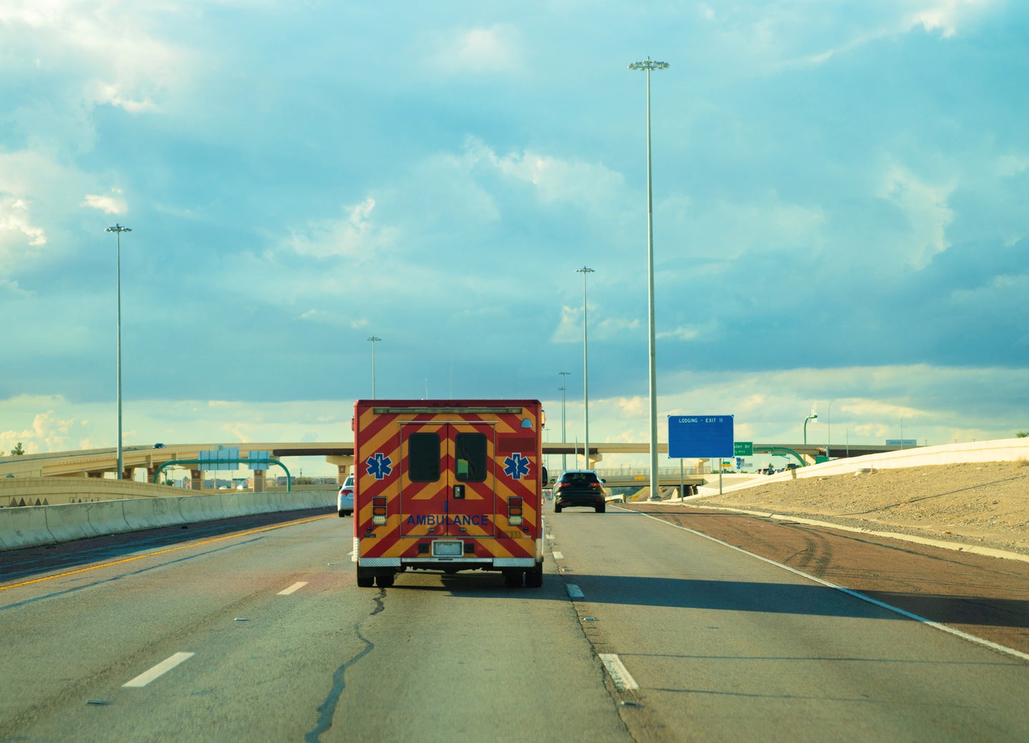 Ambulance driving on the highway in Texas. THEPALMER/Getty Images