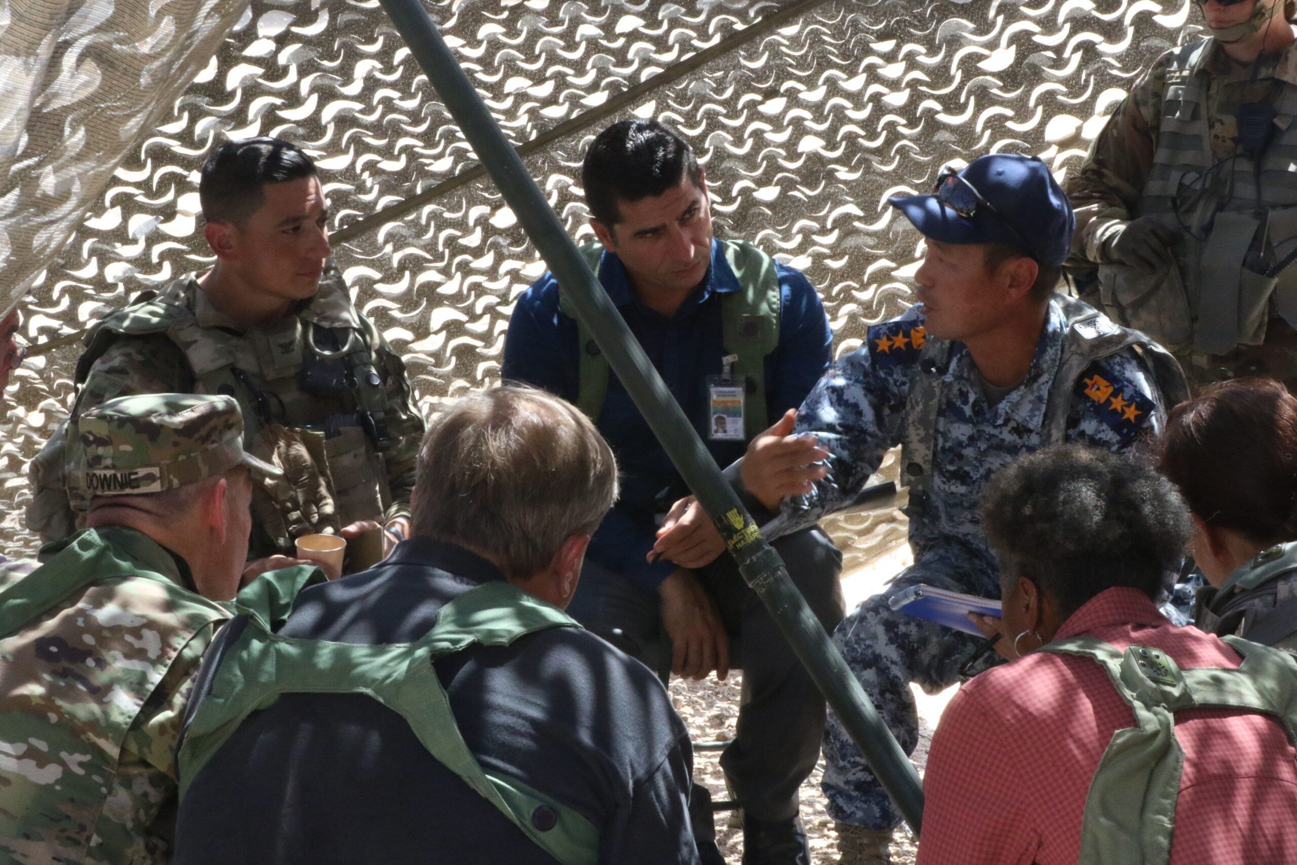 Col. Jonathan Chung, commander of 2-2 Stryker Brigade Combat Team, speaks with the Provincial Chief of Police and Department of State officials of a fictional country they're deployed to during a Key Leader Engagement at National Training Center in Fort Irwin, Ca on 2 Sep.