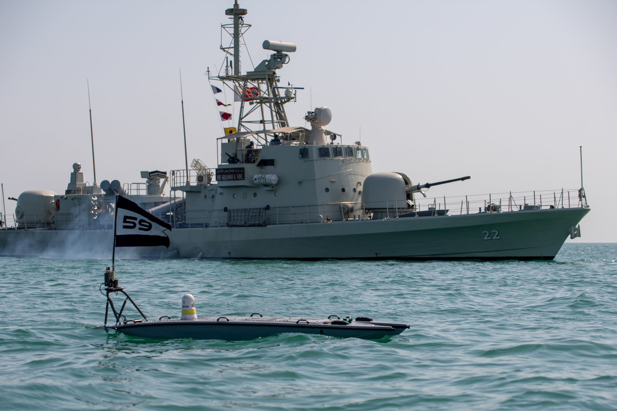 A MANTAS T-12 unmanned surface vessel (USV), front, operates alongside Royal Bahrain Naval Force fast-attack craft RBNS Abdul Rahman Al-fadel (P22) during exercise New Horizon in the Arabian Gulf, Oct. 26. Exercise New Horizon was U.S. Naval Forces Central Command Task Force 59’s first at-sea evolution since its establishment Sept. 9. (U.S. Navy photo by Mass Communication Specialist 2nd Class Dawson Roth)