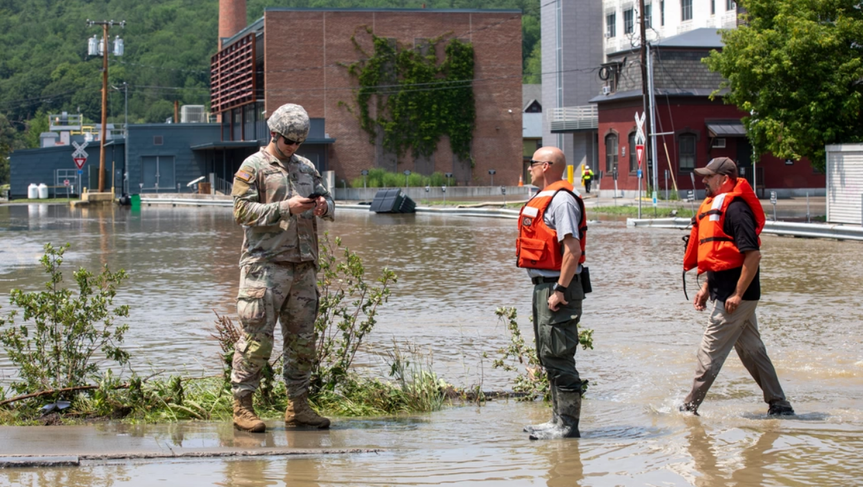 1st Lt. Paul Pennoyer, the head of the 172nd Military Police Detachment of the Vermont National Guard, coordinates with local search and rescue during flooding in Vermont. (Photo by Sgt. Denis Nunez, Vermont National Guard)