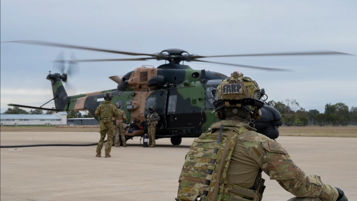 An Australian MRH-90 Taipan helicopter is refueled during Talisman Sabre 2023. (Photo by Airman 1st Class Tylir Meyer/ U.S. Air Force)