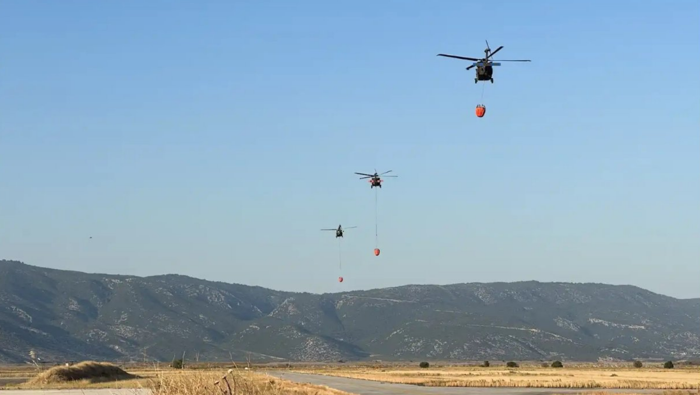 U.S. Army UH-60 helicopters conducting firefighting operations in Greece. (Photo courtesy U.S. European Command)