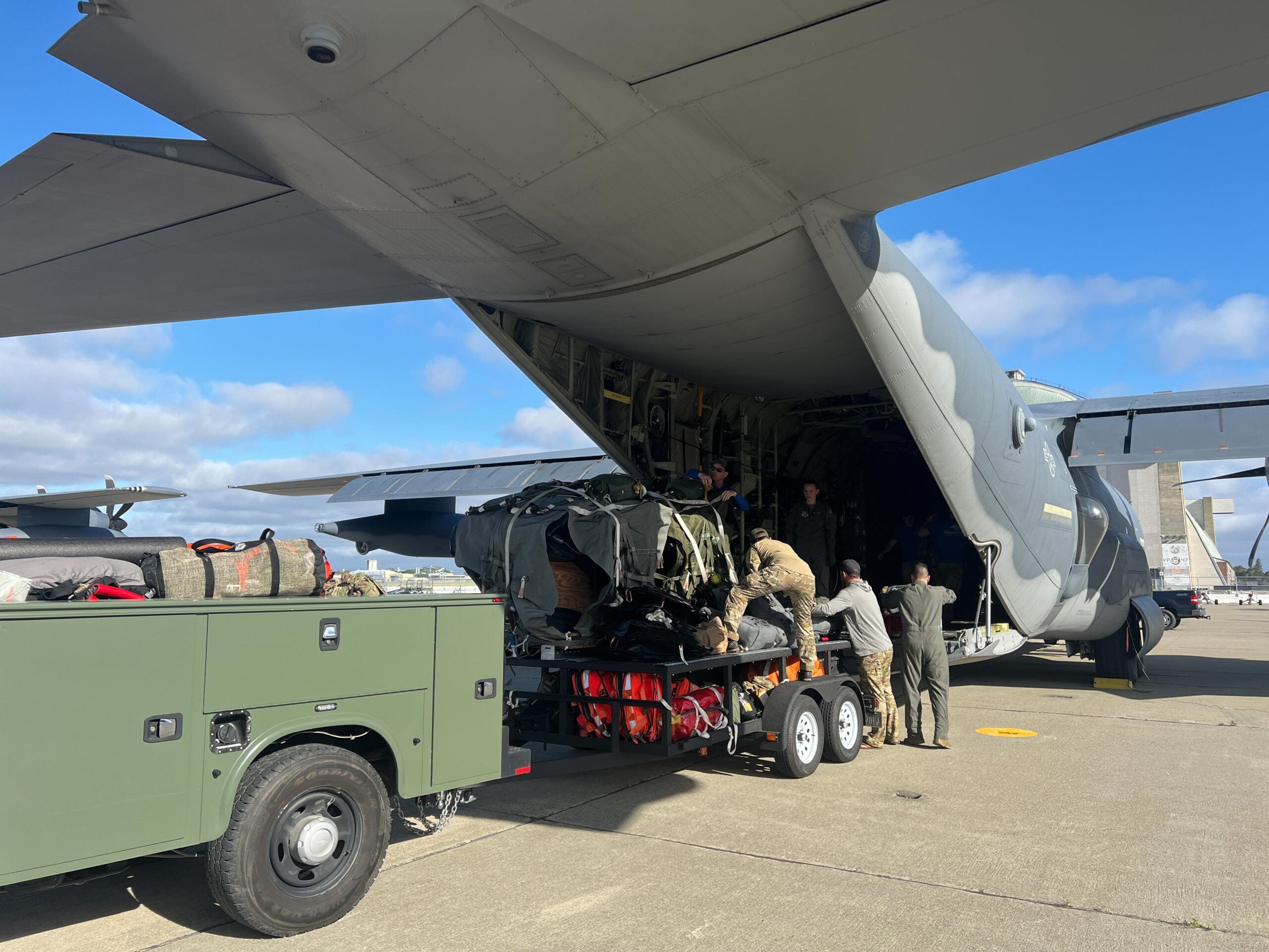 U.S. Air Force Airmen with the 129th Rescue Wing load equipment and supplies onto an HC-130J Combat King II aircraft at Moffett Air National Guard Base, California in preparation for a rescue mission, July 8, 2023. (U.S. Air National Guard photo by Staff Sgt. Duane Ramos)