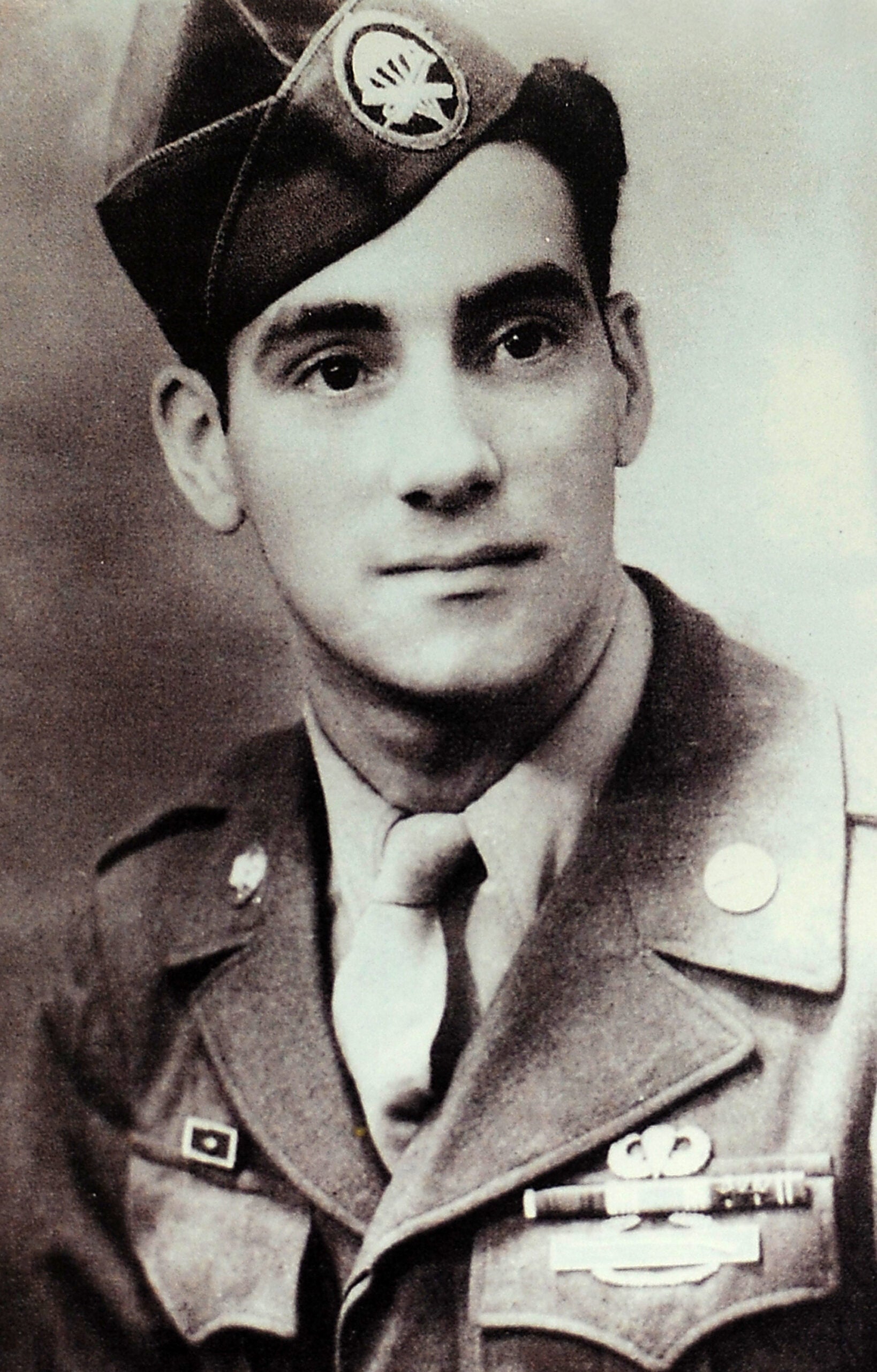 Digital photograph of a photograph provided by World War II veteran Vincent Speranza, 88, from Auburn Ill., taken of him in Scotland during World War II. Speranza visited soldiers of the 1st Battalion (Airborne), 501st Infantry Regiment, part of U.S. Army Alaska's 4th Infantry Brigade Combat Team (Airborne), 25th Infantry Division, at Joint Base Elmendorf-Richardson, Alaska, Nov. 6. Speranza, a combat veteran of H Company, 501st Parachute Infantry Regiment, then part of the 101st Airborne Division, fought at Bastogne, was wounded in combat shortly after the Battle of the Bulge, and when the 101st Airborne deactivated after the war was transferred to the 82nd Airborne for a brief period. (U.S. Air Force photo by Justin Connaher/Released)