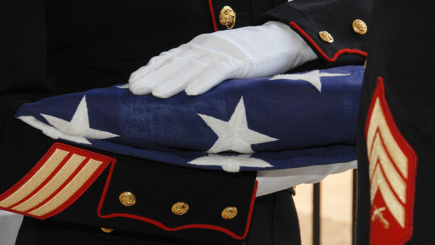 Marine with folded flag