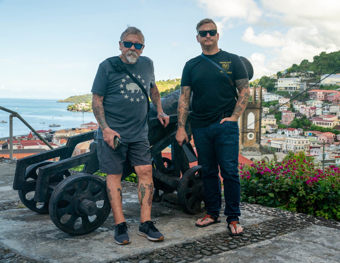 Father and son, both Rangers, pose for a photo in Grenada.
