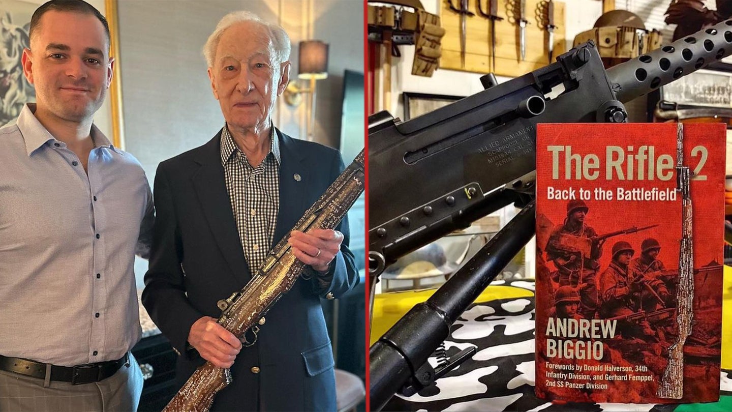 Andrew Biggio with a WW II veteran holding the M1 Garand with 300 signatures on it. The Rifle 2 book.