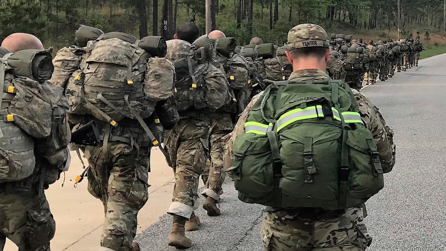 U.S. Army soldiers ruckmarching with both the ALICE and MOLLE packs.