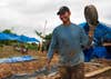 180723-N-VQ790-031 LAOS. (July 23, 2018) U.S. Air Force Master Sgt. Paul White, a recovery NCO assigned to the Defense POW/MIA Accounting Agency (DPAA) recovery team, carriers a hose. The DPAA mission is to provide the fullest possible accounting for our missing personnel to their families and the nation. (U.S. Navy photo by Mass Communication Specialist 3rd Class Trey Hutcheson)
