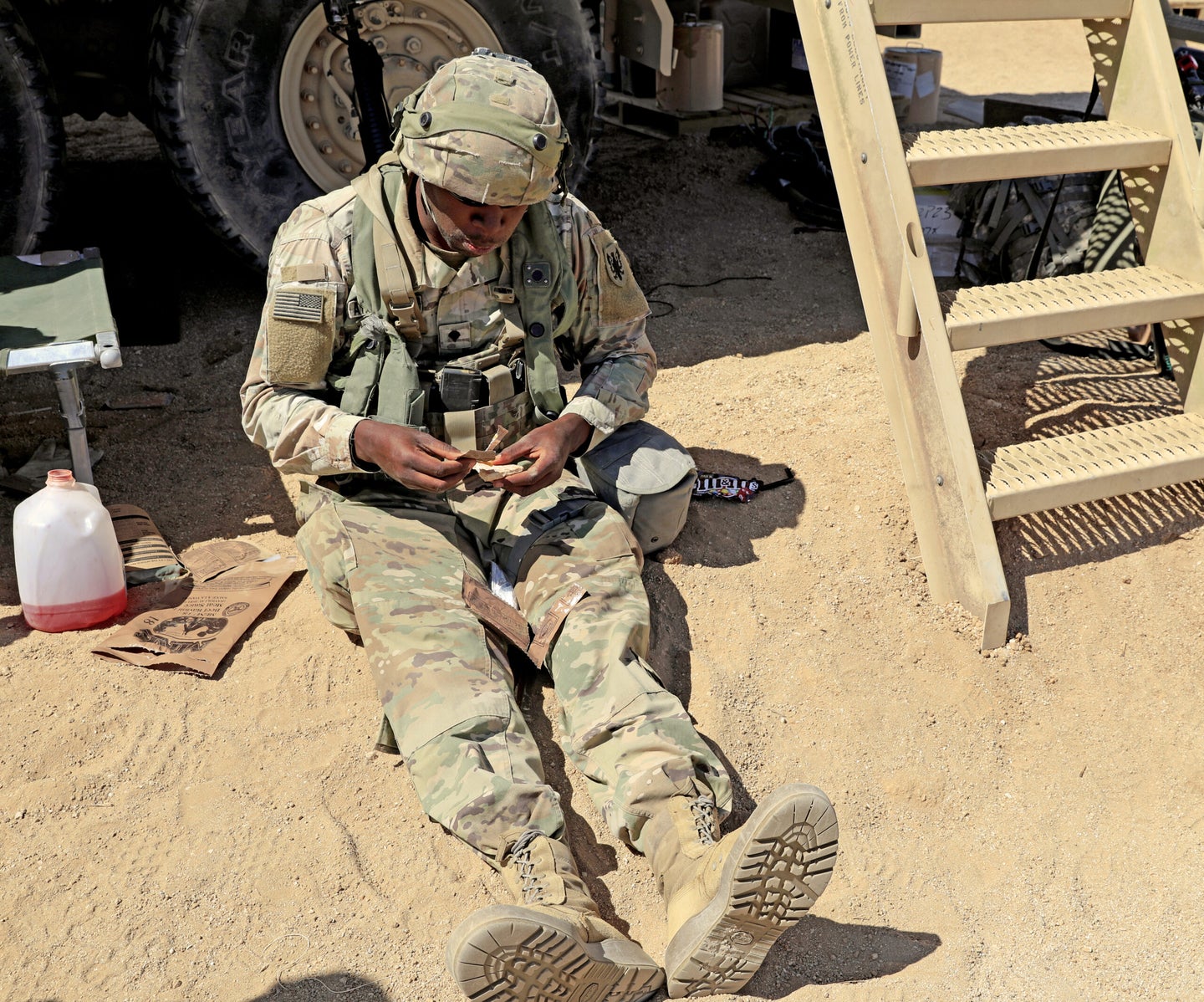 A soldier enjoying an MRE and a much needed break.