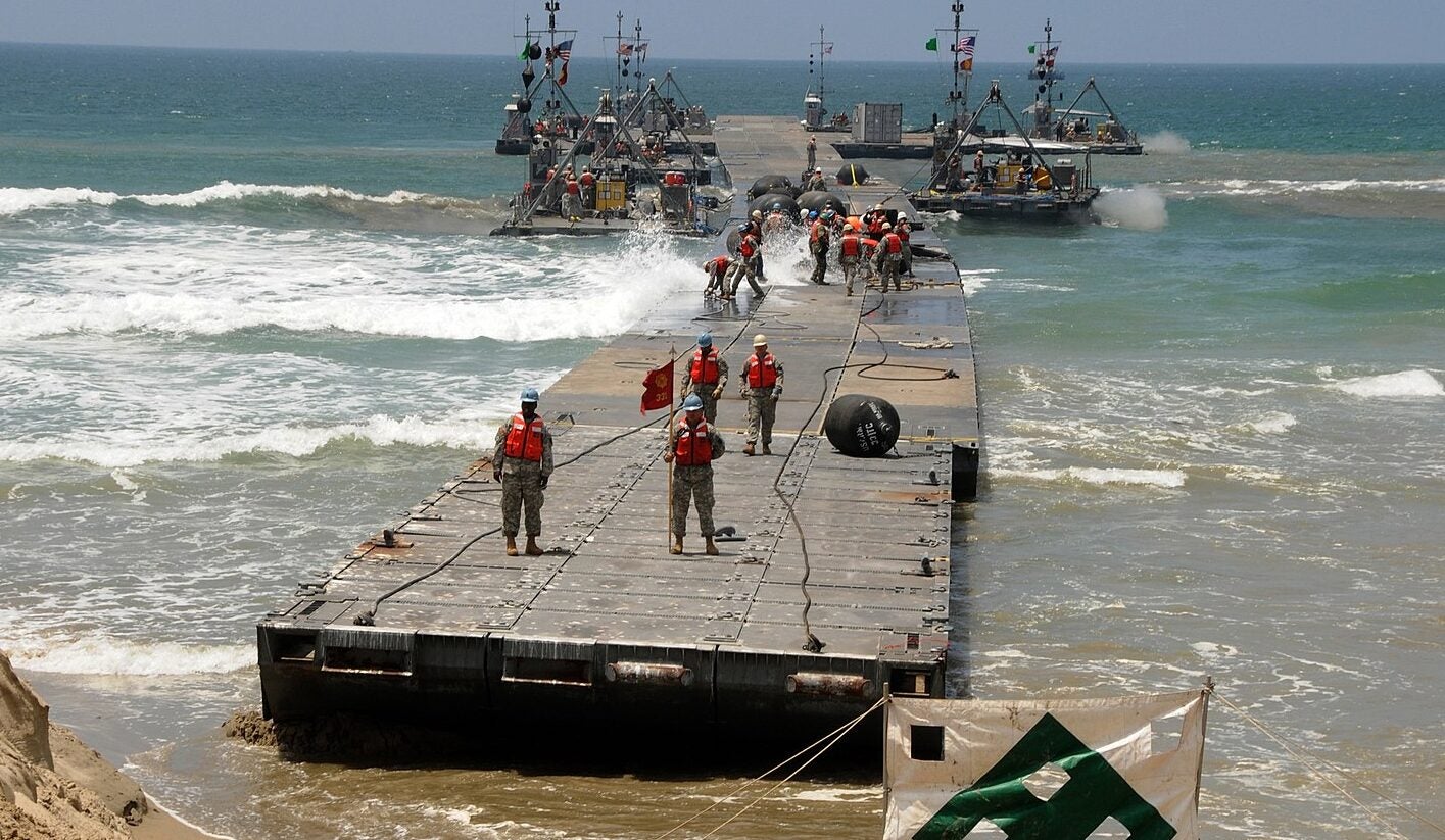 An Army Trident pier is driven onto a beach during Joint Logistics Over-The-Shore (JLOTS) an exercise in 2008. Navy photo by Mass Communication Specialist 2nd Class Brian P. Caracci.