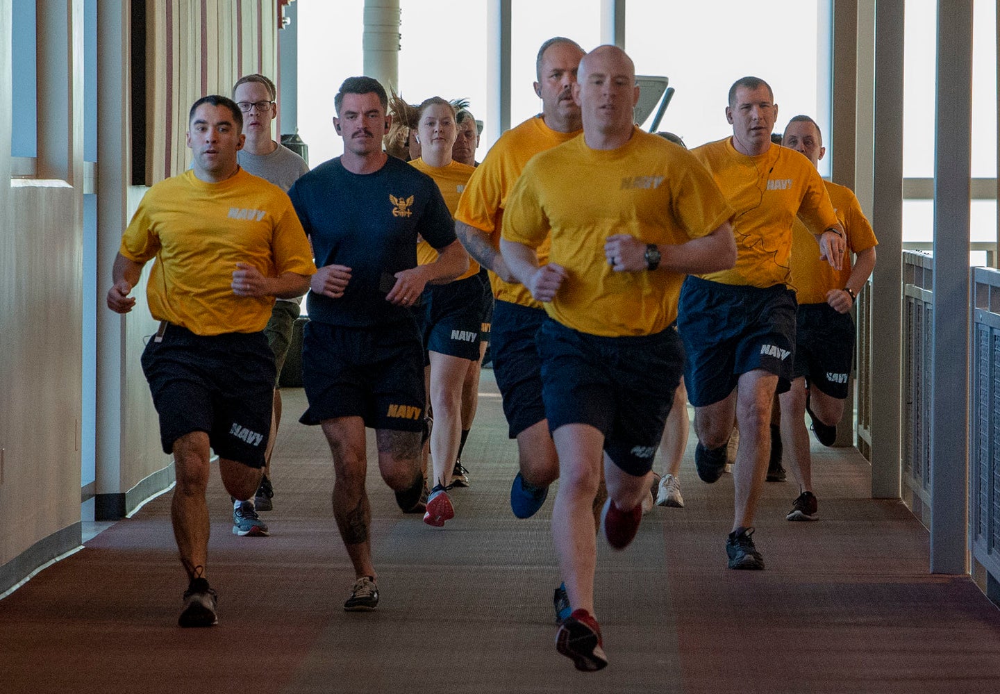 Navy gyms and fitness centers around the world may soon be open for use 24 hours a day under a new Navy policy. Navy photo by Mass Communication Specialist 1st Class Gilbert Bolibol.