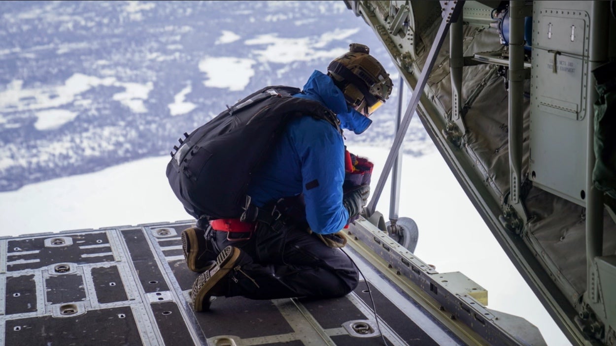 A Pararescue jumpmaster with the 212th Rescue Squadron spots a landsite aboard a HC-130J Combat King II. (photo by Dana Rosso/Alaska National Guard)