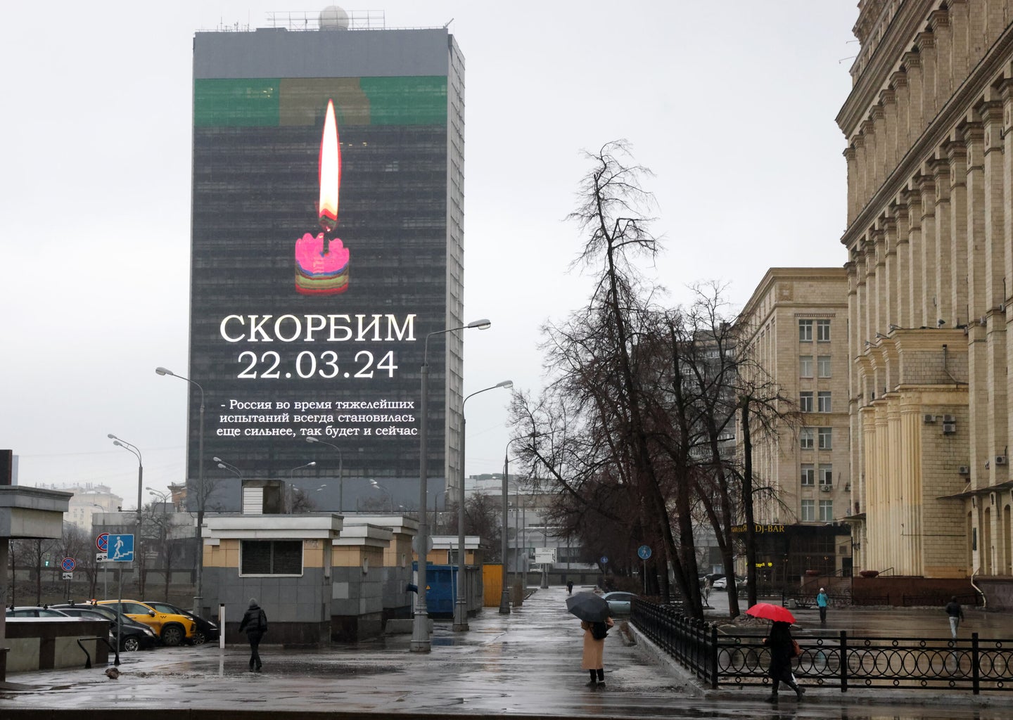MOSCOW, RUSSIA - MARCH 24: (RUSSIA OUT) The sign "We mourn. 22.03.2024" and a picture of a candle are displayed on a building to respect the victims of the Crocus City Hall terrorist attack on March 24, 2024, in Moscow, Russia. According to official data, at least 100 people were killed in an attack by several gunmen opening fire during a concert by a local rock band at Crocus City Hall, which seats about 6200 people. The deadliest attack in recent years in Russia also left the concert hall in flames and the roof severely damaged. (Photo by Contributor/Getty Images)