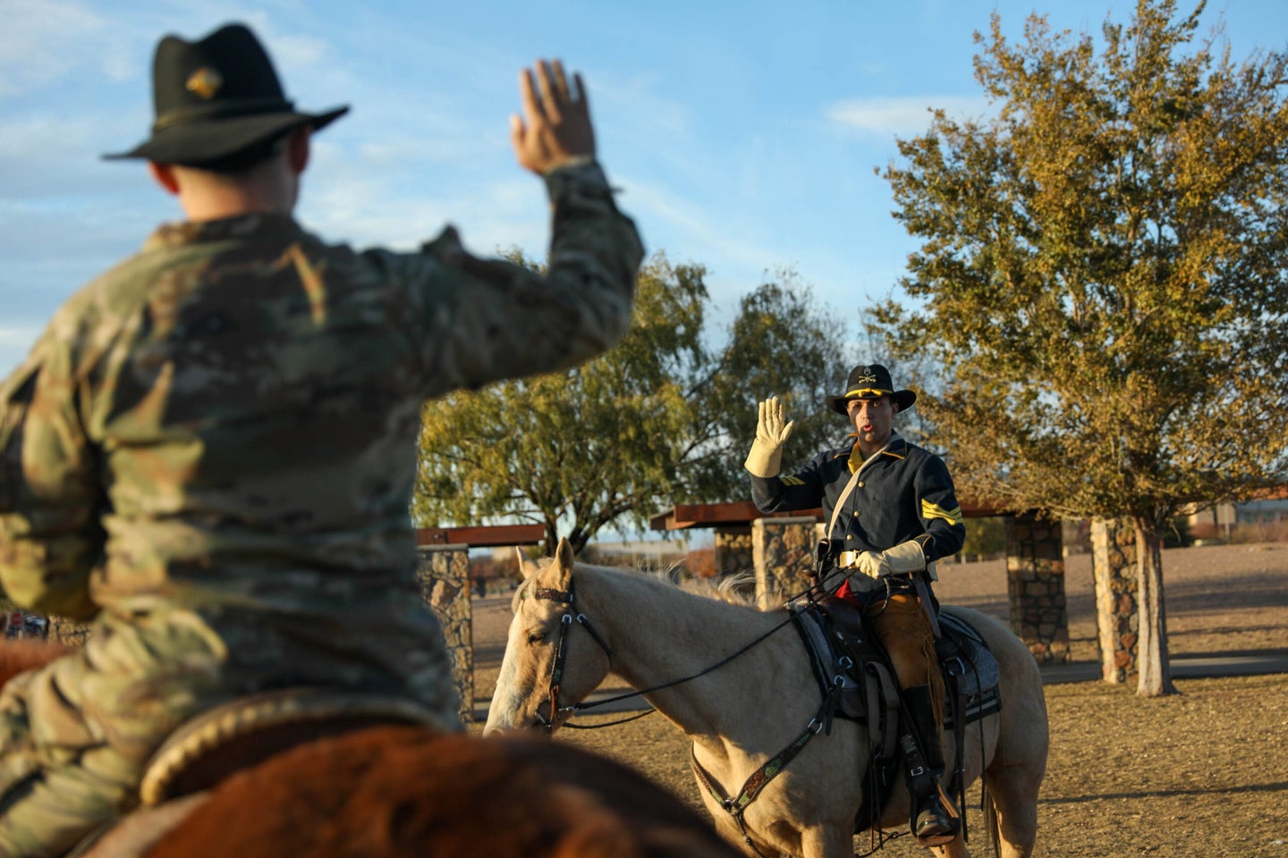 Cavalry scout on horseback reciting his reenlistment oath