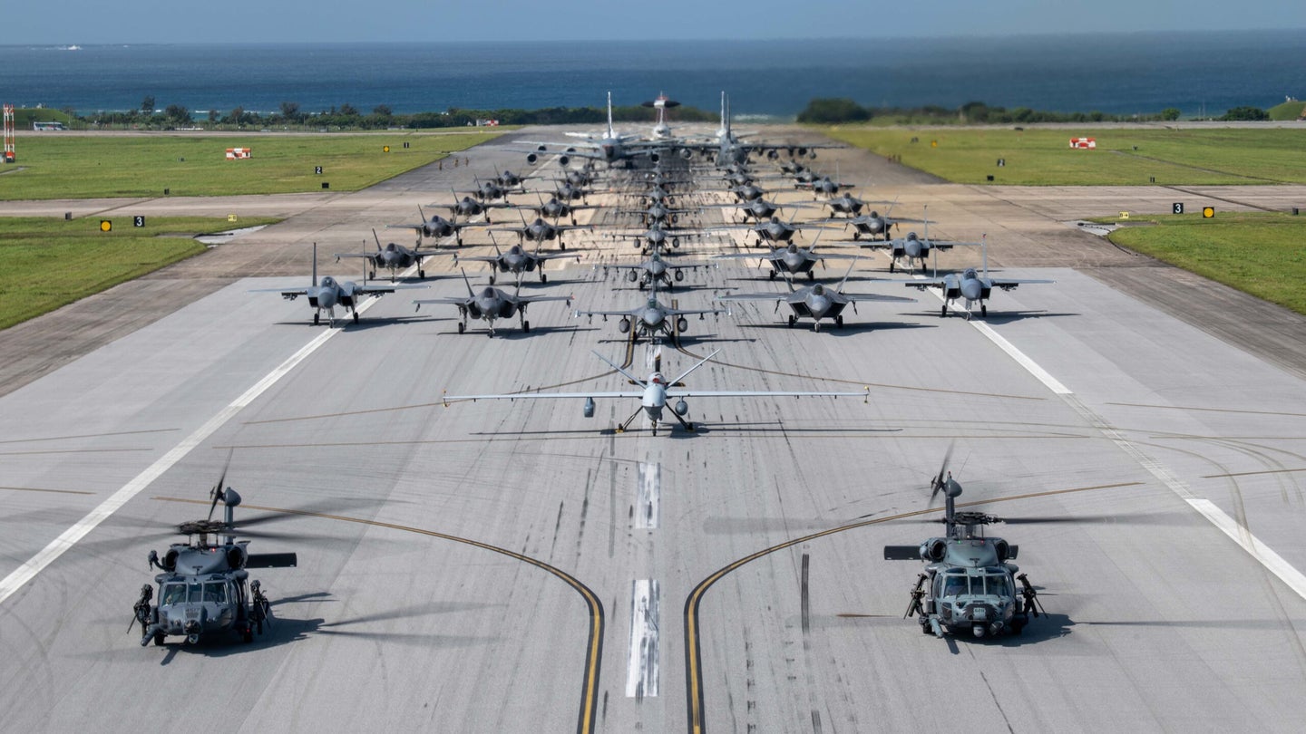 Air Force and Navy aircraft line the runway at Kadena Air Base for an elephant walk on April 11, 2024. (photo by Airman 1st Class Alexis Redin/U.S. Air Force)