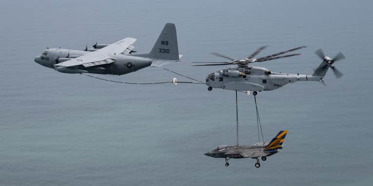 This new Marine Corps helicopter refueled from a Navy tanker while carrying a Navy fighter