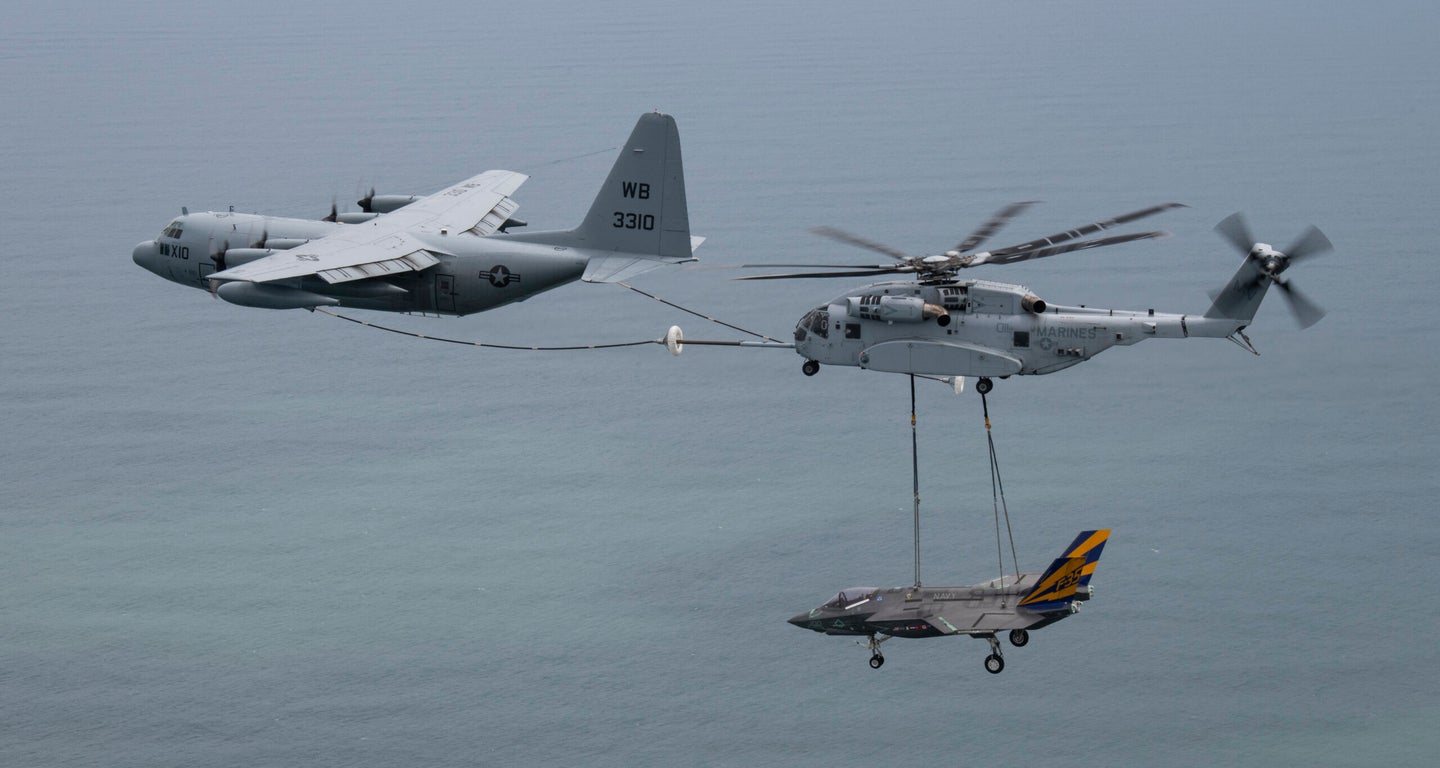 A Marine flight crew in a CH-53K King Stallion heavy-lift helicopter transported an F-35C Lightning II airframe while air-to-air refueling from a Navy C-130T. Photo by Photo by Kyra Helwick