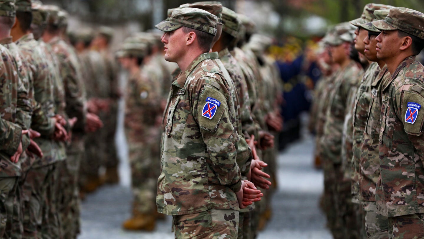 Soldiers of 10th Mountain Division stand in formation prior to marching during the pass and review for the Transfer of Authority Ceremony on April 5, 2023, at the Carol I National Defense University in downtown Bucharest. Photo by Sgt. Amber Edwards