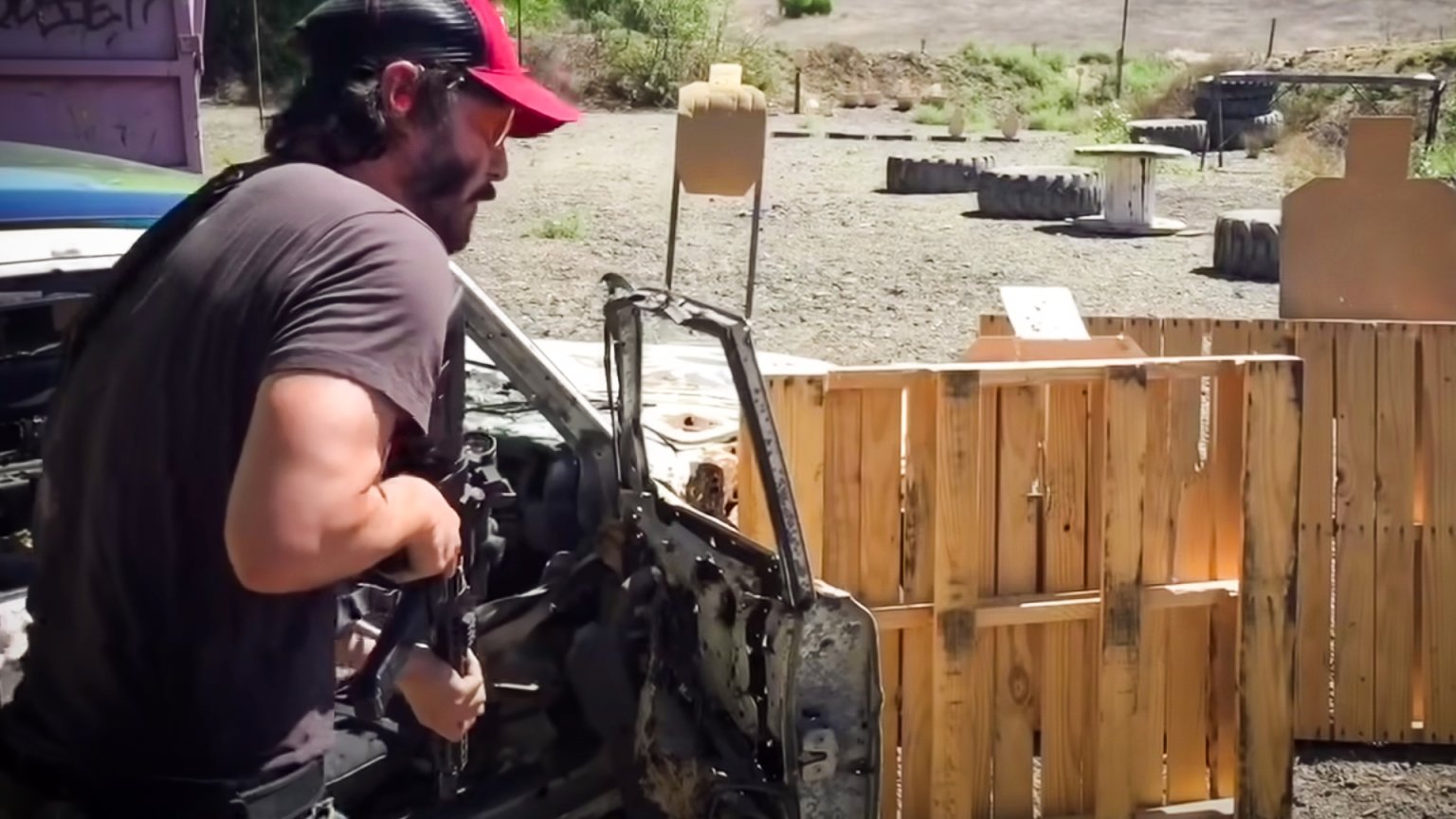 Keanu Reeves Machine Gun Watch Keanu Reeves destroy this gun range
