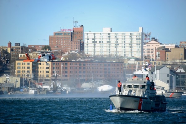 A NJ man called the Coast Guard after gun-toting neighbors attempted to impose a quarantine on him in Maine