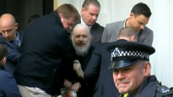 Watch Julian Assange, looking like bearded David Letterman, as he’s arrested outside Ecuador’s embassy