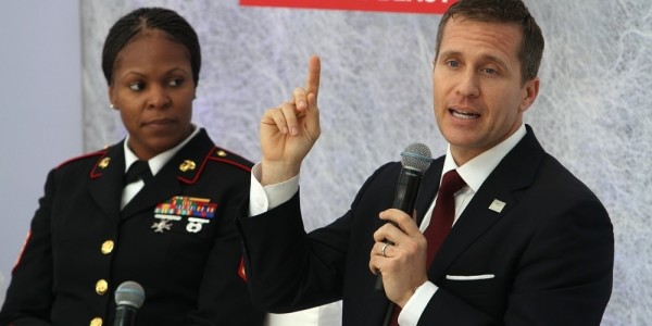 Eric Greitens with hand raised