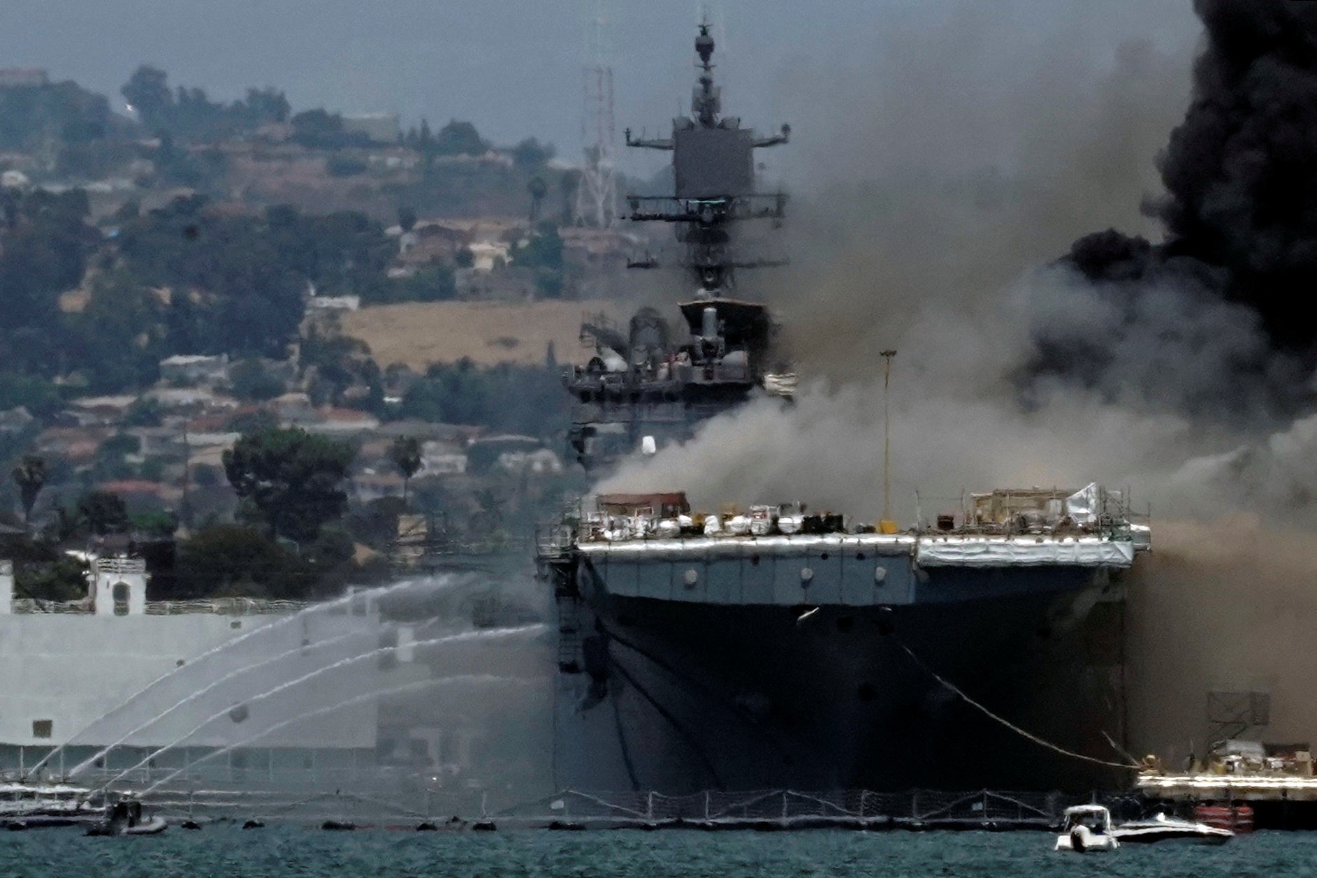 Smoke rises from a fire on board the U.S. Navy amphibious assault ship USS Bonhomme Richard at Naval Base San Diego