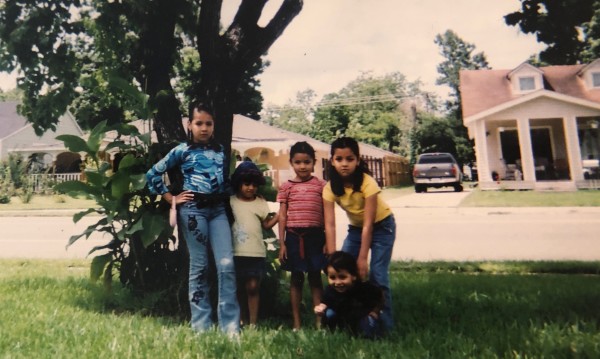 Lupe and Vanessa by a tree