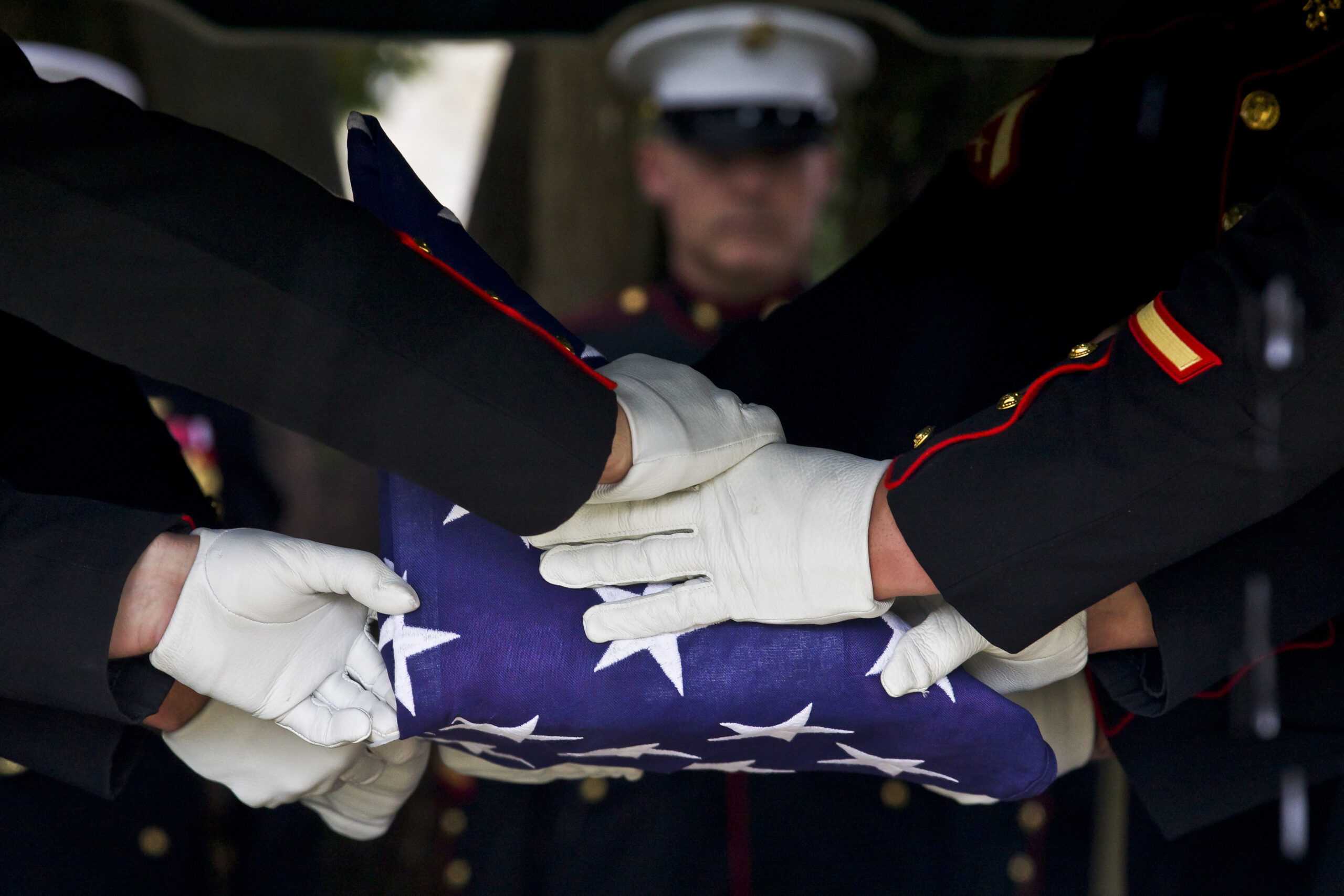 Marine with folded flag