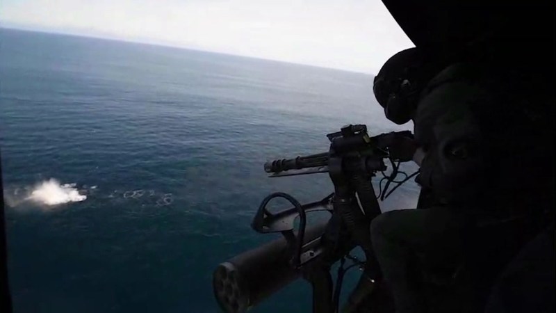 Marine Fires GAU-17 minigun from a UH-1Y Venom