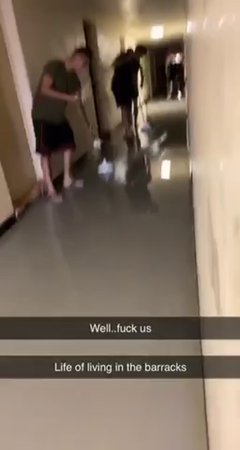 Marines sweeping water out of barracks in Japan