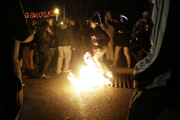 Watch Members Of The National Guard Recover Pieces Of An American Flag Burned In Ferguson