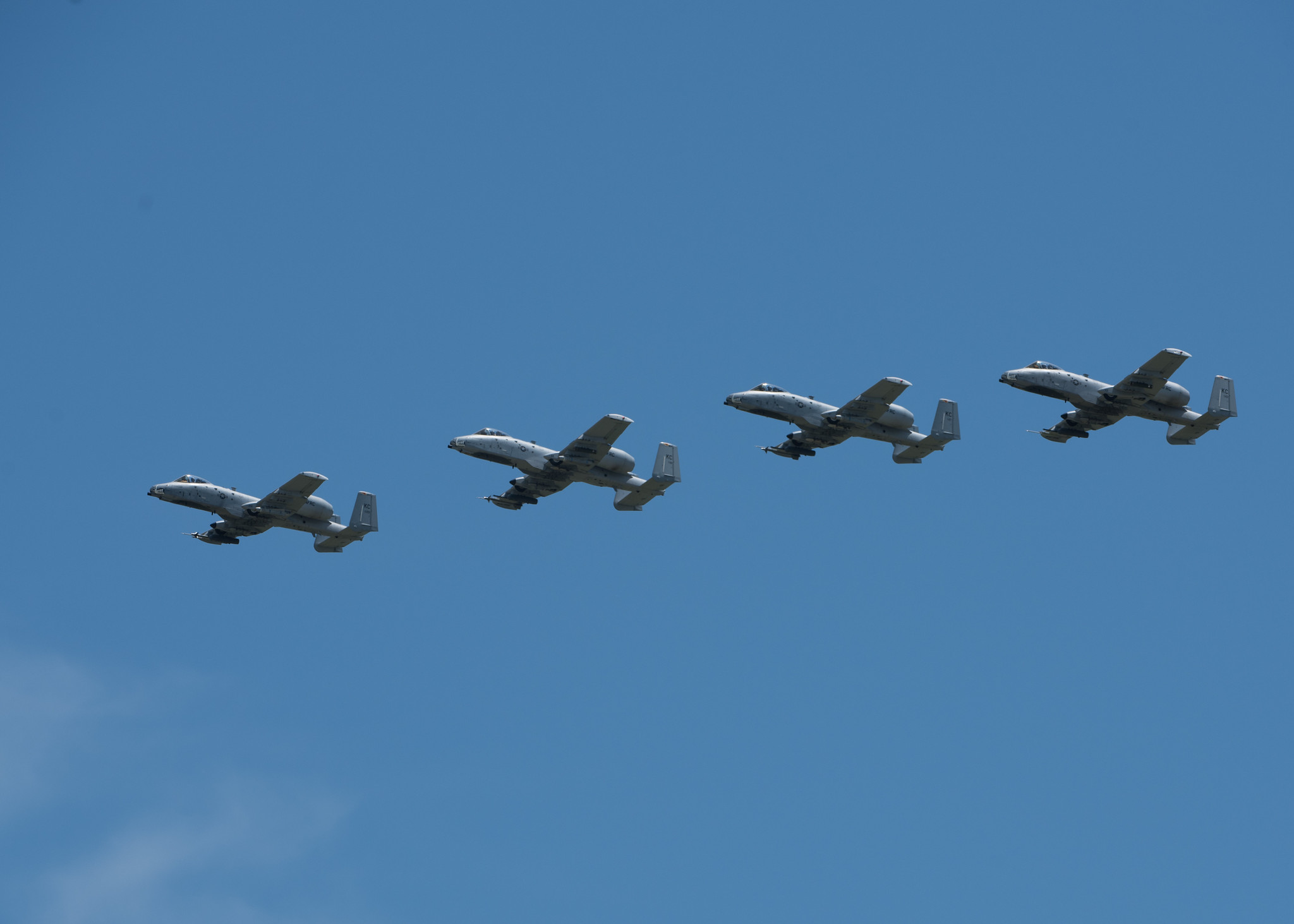 Four A-10 Thunderbolt IIs with the 442nd Fighter Wing fly in formation during the Wings Over Whiteman airshow on June 15, 2019, at Whiteman Air Force Base, Missouri.  (U.S. Air Force/ Airman 1st Class Parker J. McCauley)